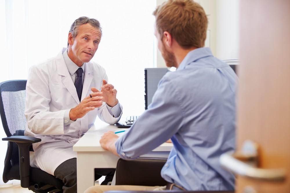 Doctor explains testosterone therapy to a male patient.