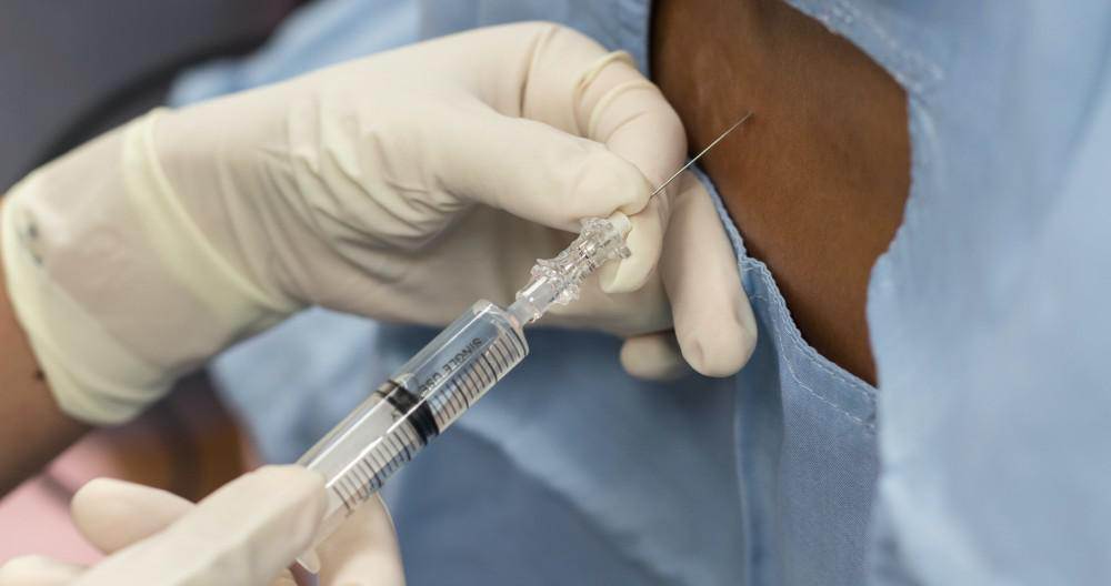 Close-up of a pain-relieving injection being administered.