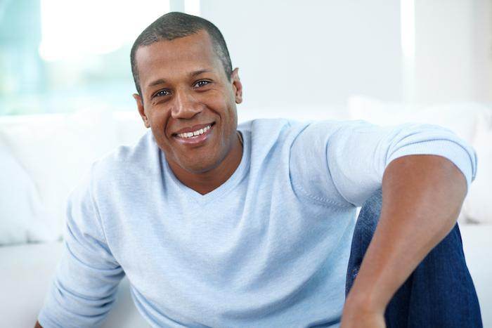 Smiling man likely feeling benefits of testosterone therapy.